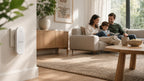 Family relaxing with a PestCalm device plugged in nearby